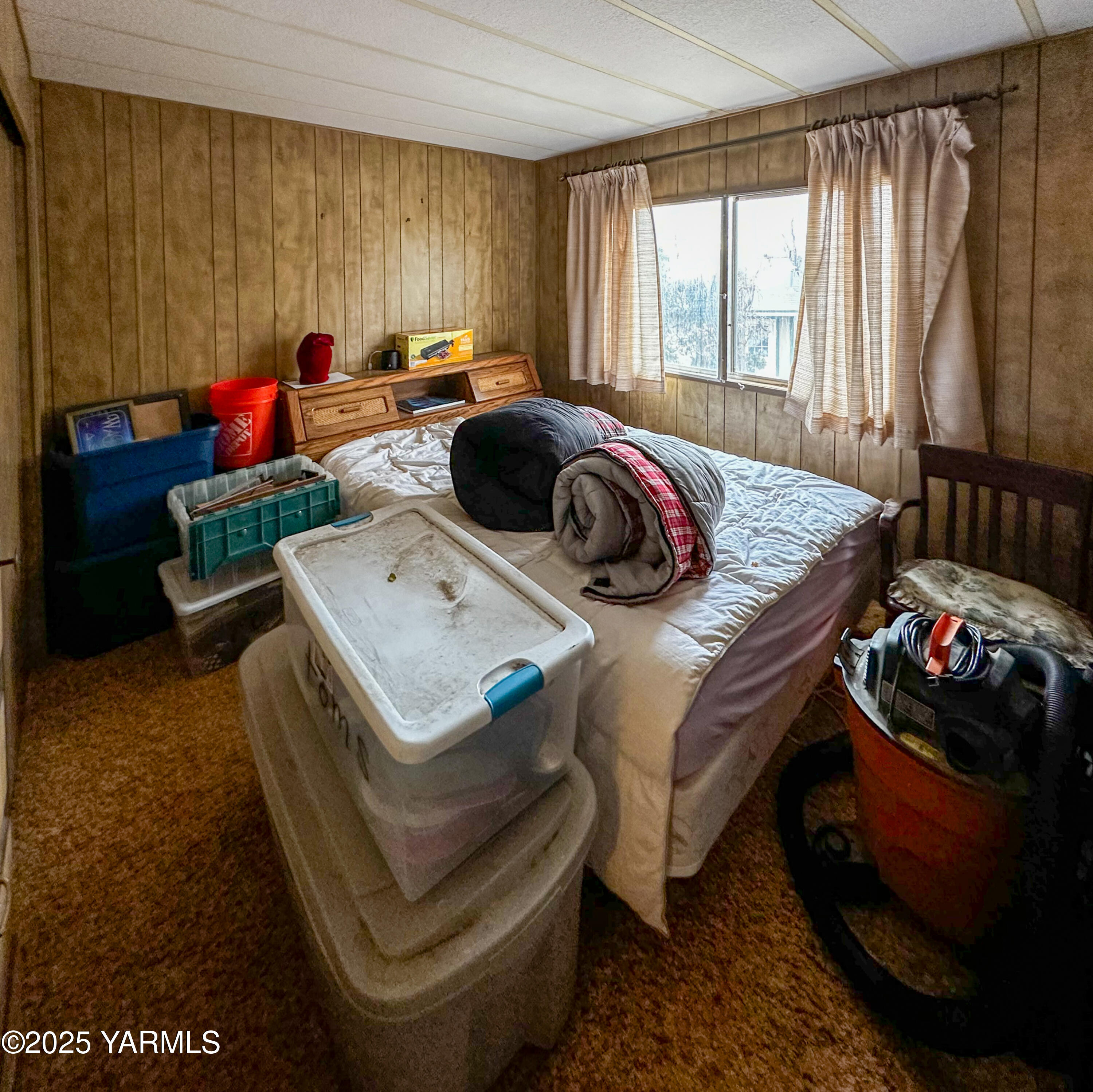 10 Wiland Heights Road Selah, WA 98942 - Photo 11 of 16 a bed sitting in a bedroom next to a window