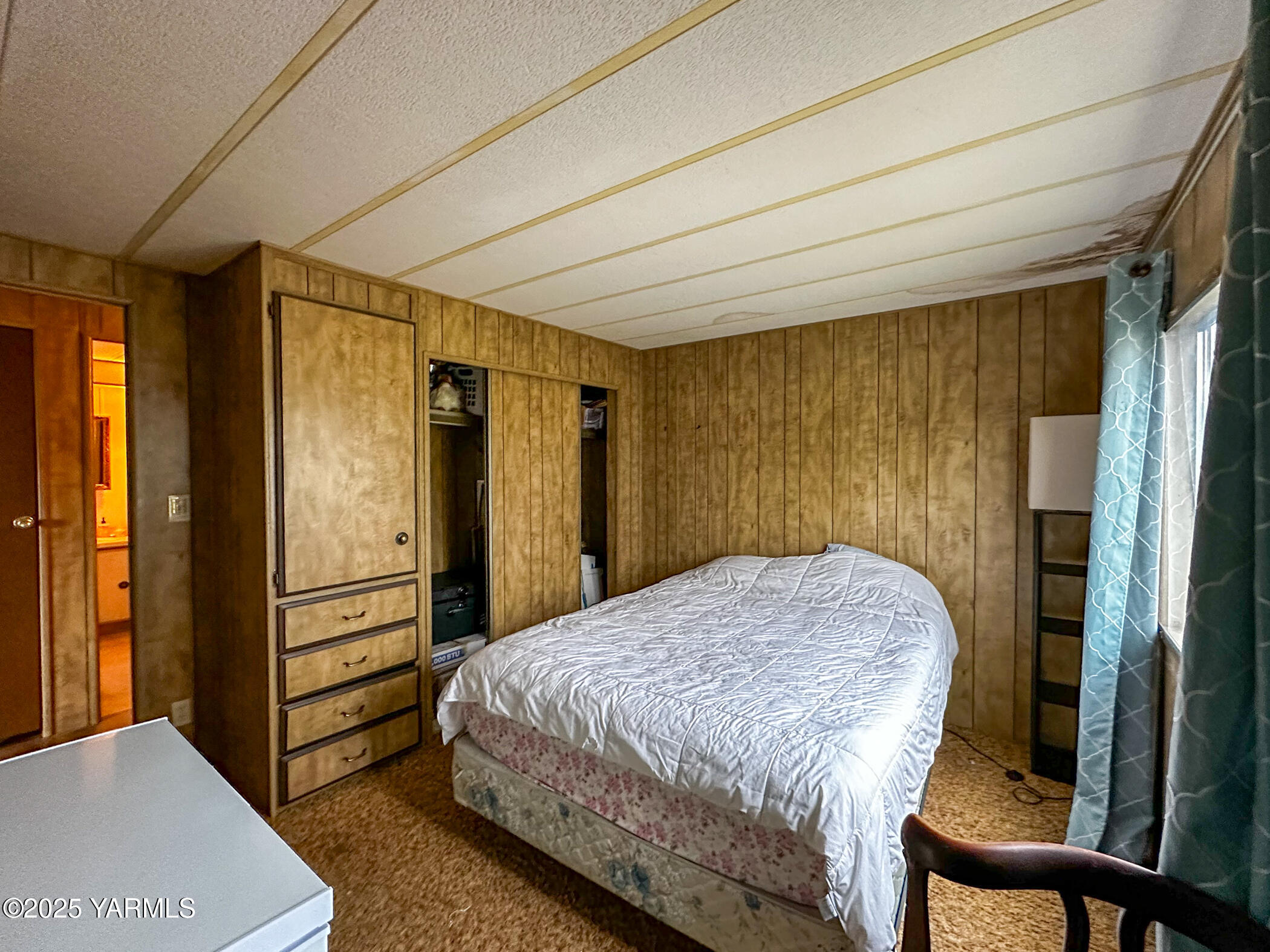 10 Wiland Heights Road Selah, WA 98942 - Photo 12 of 16 a bedroom with a bed and a dresser