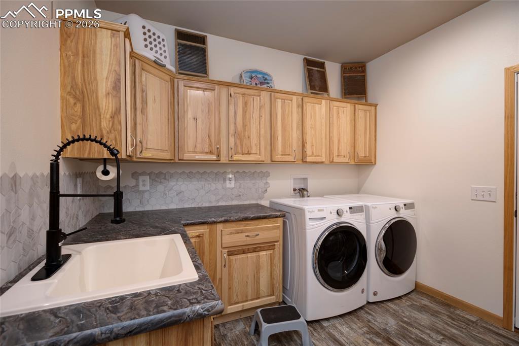 24965 Cave Spg Trail Elbert, CO 80106 - Photo 12 of 50 a utility room with sink dryer and washer