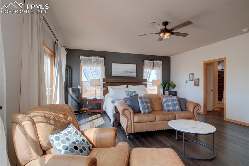 24965 Cave Spg Trail Elbert, CO 80106 - Photo 15 of 50 a living room with furniture and a wooden floor