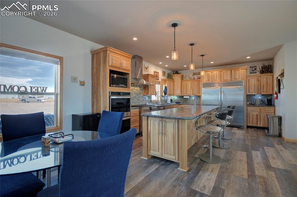 24965 Cave Spg Trail Elbert, CO 80106 - Photo 23 of 50 a living room with furniture and a wooden floor