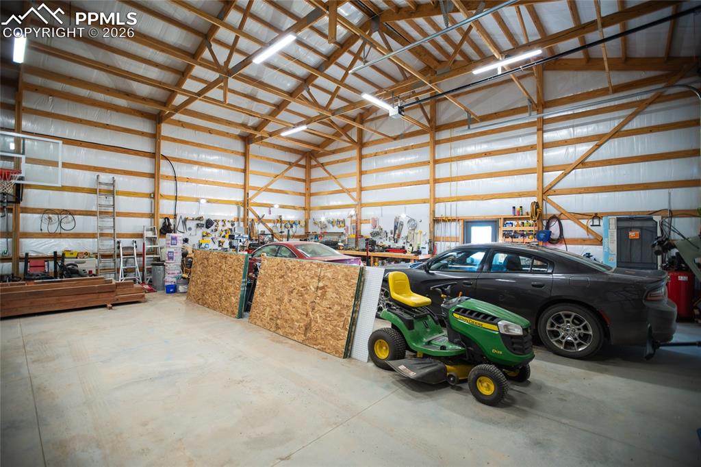 24965 Cave Spg Trail Elbert, CO 80106 - Photo 33 of 50 a car and car parked in garage