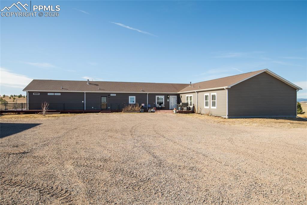 24965 Cave Spg Trail Elbert, CO 80106 - Photo 41 of 50 a view of house with a yard