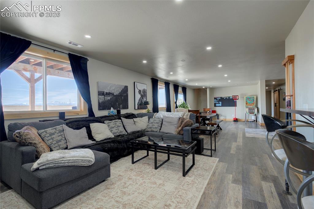 24965 Cave Spg Trail Elbert, CO 80106 - Photo 5 of 50 a living room with furniture and a flat screen tv