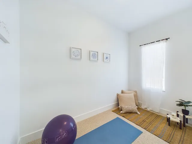 a view of multiple houses with a street