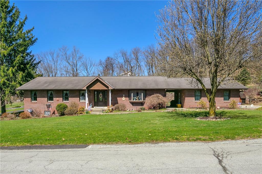 111 Francis Road Pittsburgh, PA 15239 - Photo 1 of 23 a front view of a house with a yard and trees