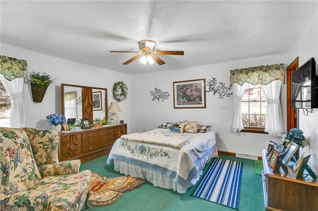 111 Francis Road Pittsburgh, PA 15239 - Photo 11 of 23 a bedroom with a bed and wooden floor