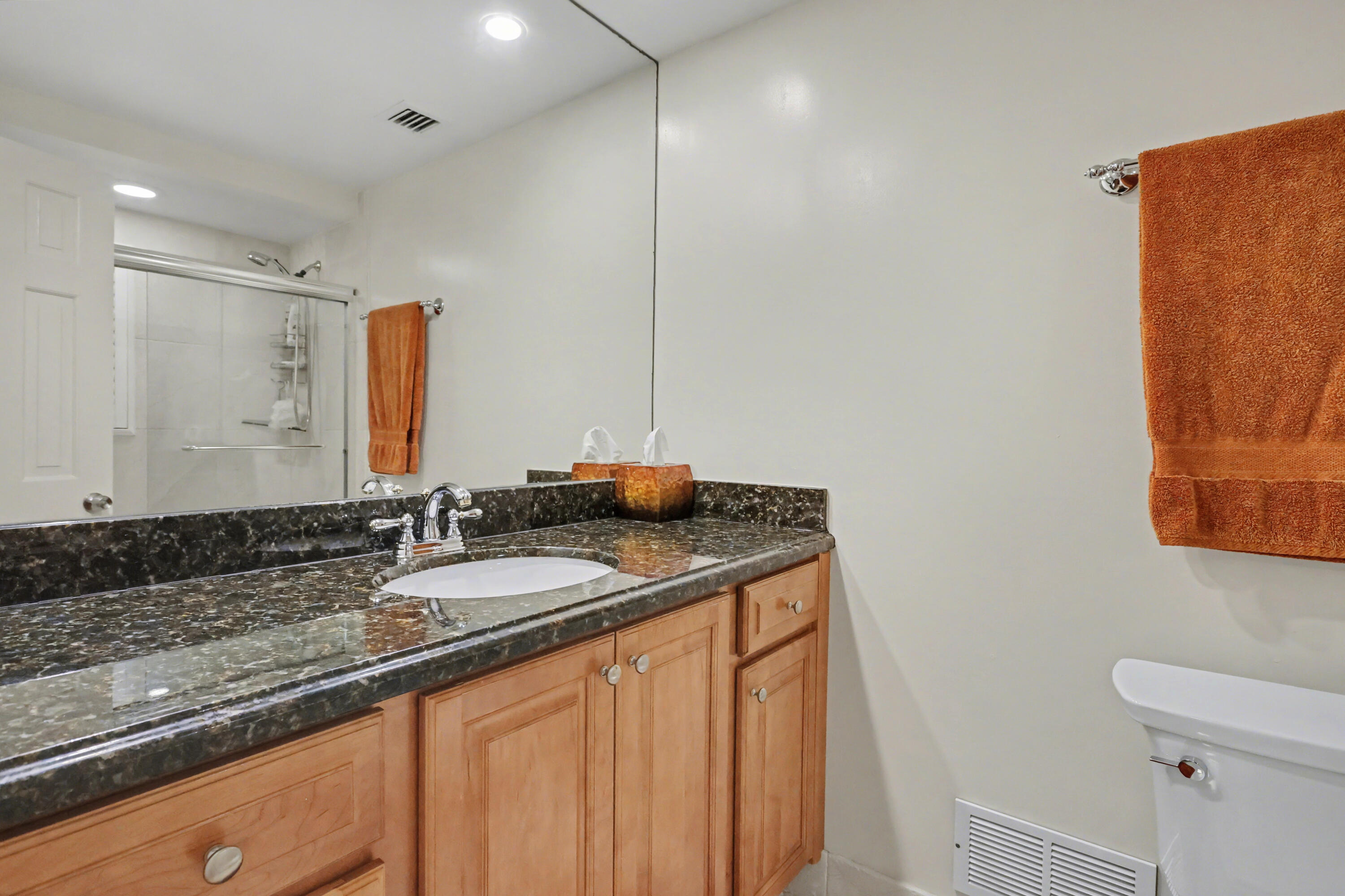 129 South Golfview Road, Unit 2 Lake Worth Beach, FL 33460 - Photo 17 of 35 a bathroom with a granite countertop sink and a mirror