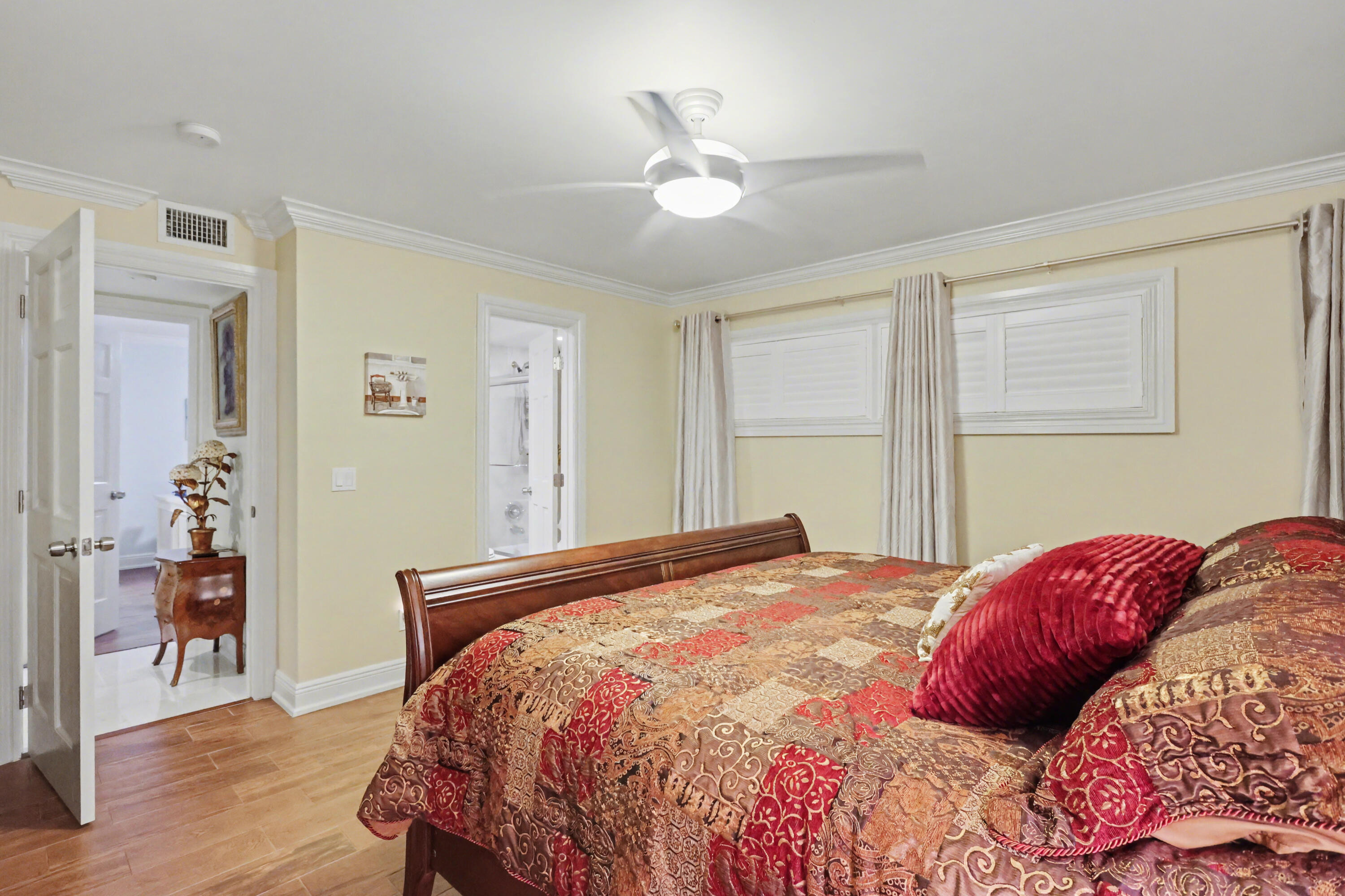 129 South Golfview Road, Unit 2 Lake Worth Beach, FL 33460 - Photo 22 of 35 a bedroom with a bed and wooden floor