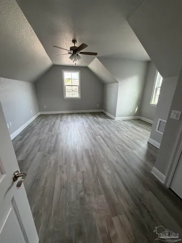 a bathroom with a sink a mirror and a shower