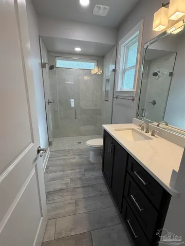 a bathroom with a toilet and a bathtub