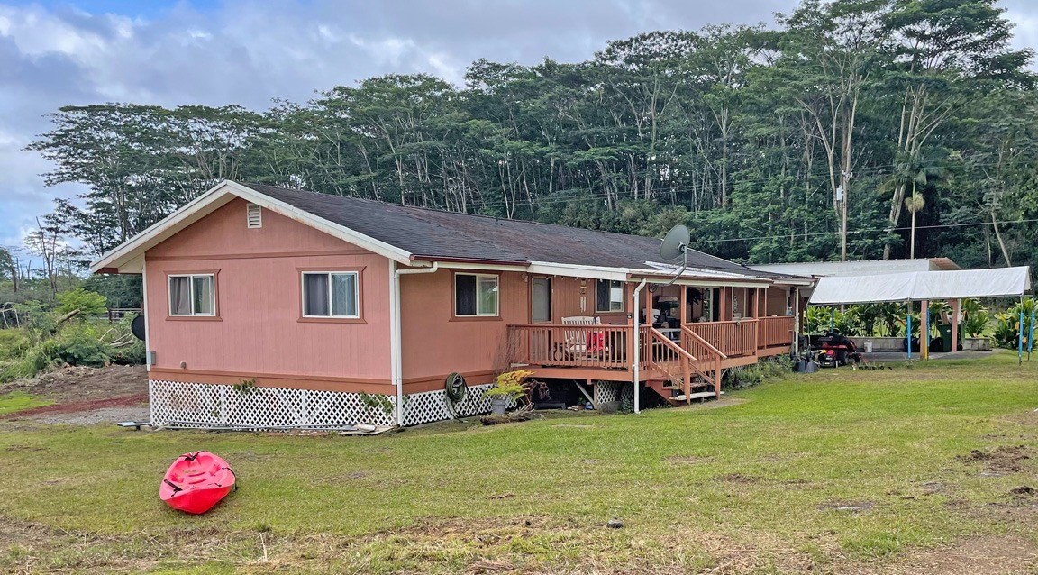136 H Hoaka Road Hilo, HI 96720 - Photo 1 of 9 a front view of a house with garden