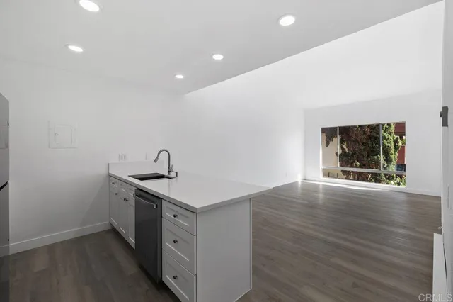 a view of kitchen with wooden floor
