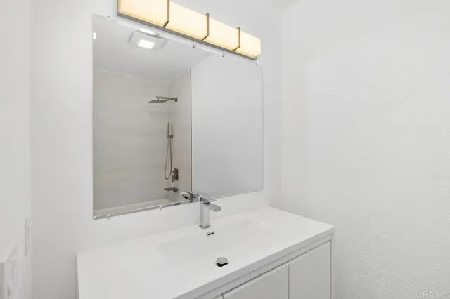 a view of a swimming pool with outdoor seating