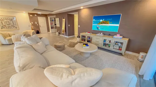 a living room with furniture and flat screen tv