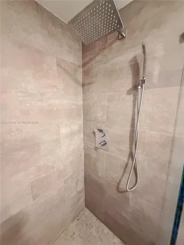 a spacious bedroom with a bed and a window