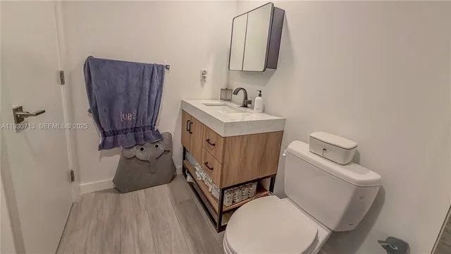 a room with a book shelf and a wooden floor