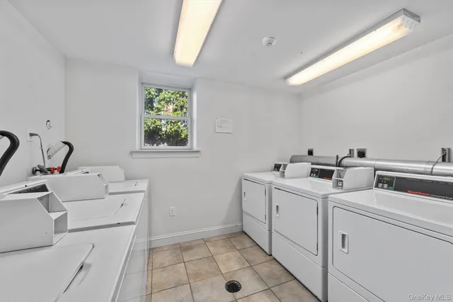 a view of storage and utility room with washer and dryer