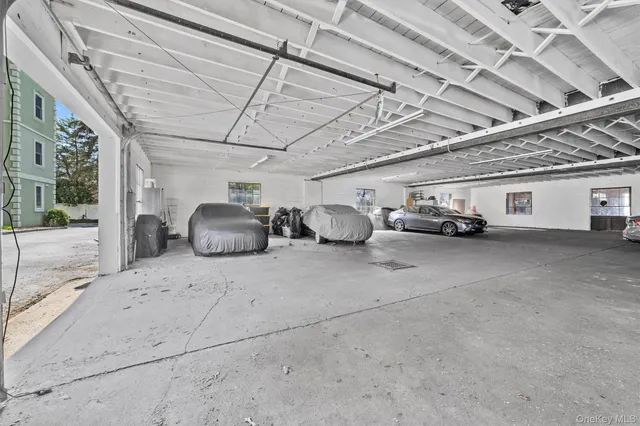 a view of parking garage with cars