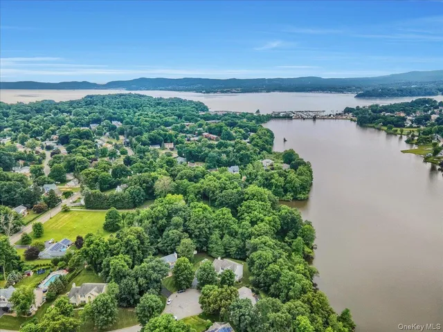 an aerial view of residential building and lake