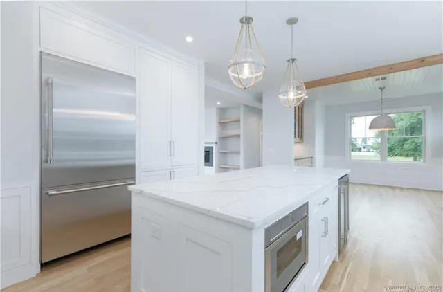 a kitchen with a refrigerator and countertop