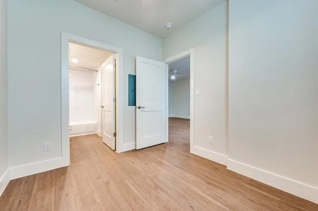 wooden floor with white walls