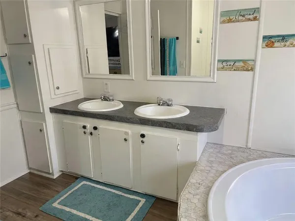 a bathroom with sink and mirror