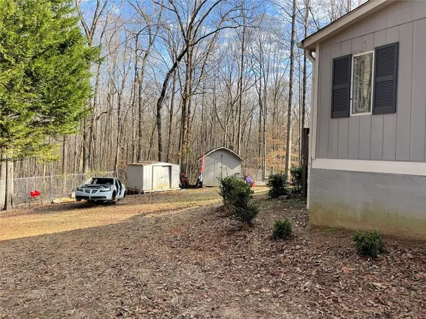 a view of a street with a car parked in front of it