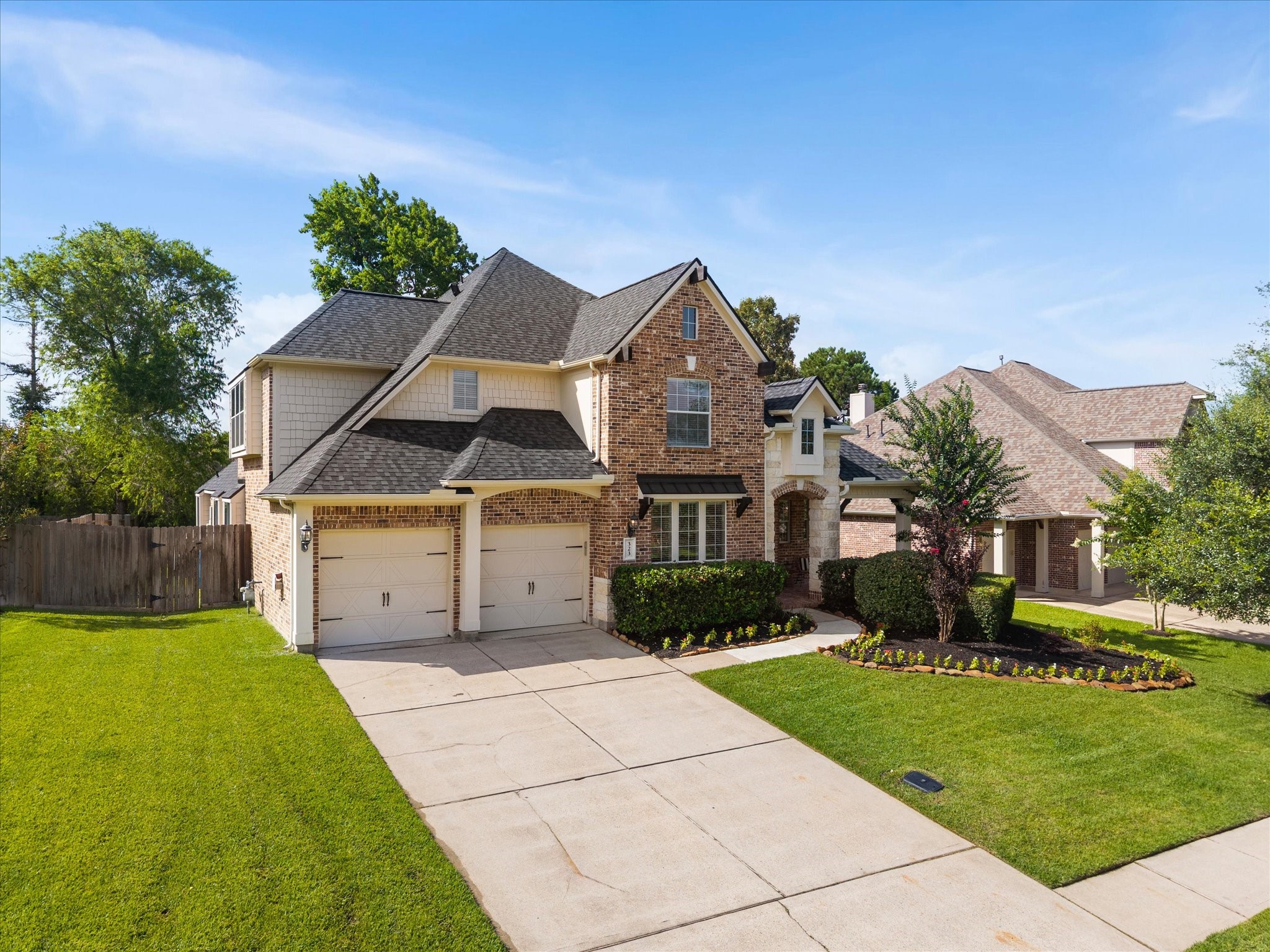 323 Arbor Ridge Lane Conroe, TX 77384 - Photo 2 of 40 Some homes just sit right on their lot. Mature trees, almost a quarter acre, and that classic brick that never goes out of style. This Conroe beauty is calling. $525,000.