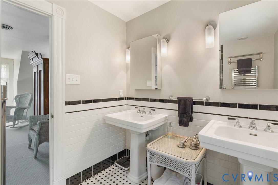 7381 McClellan Road Mechanicsville, VA 23111 - Photo 54 of 66 a bathroom with a sink and a mirror