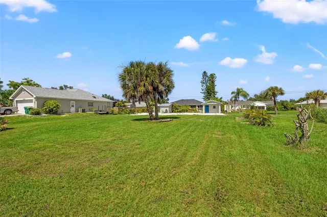 a view of an house with a yard