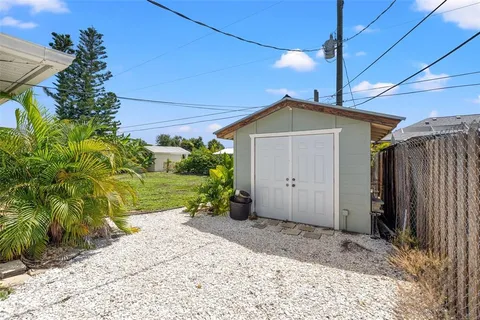 a view of a big yard with potted plants