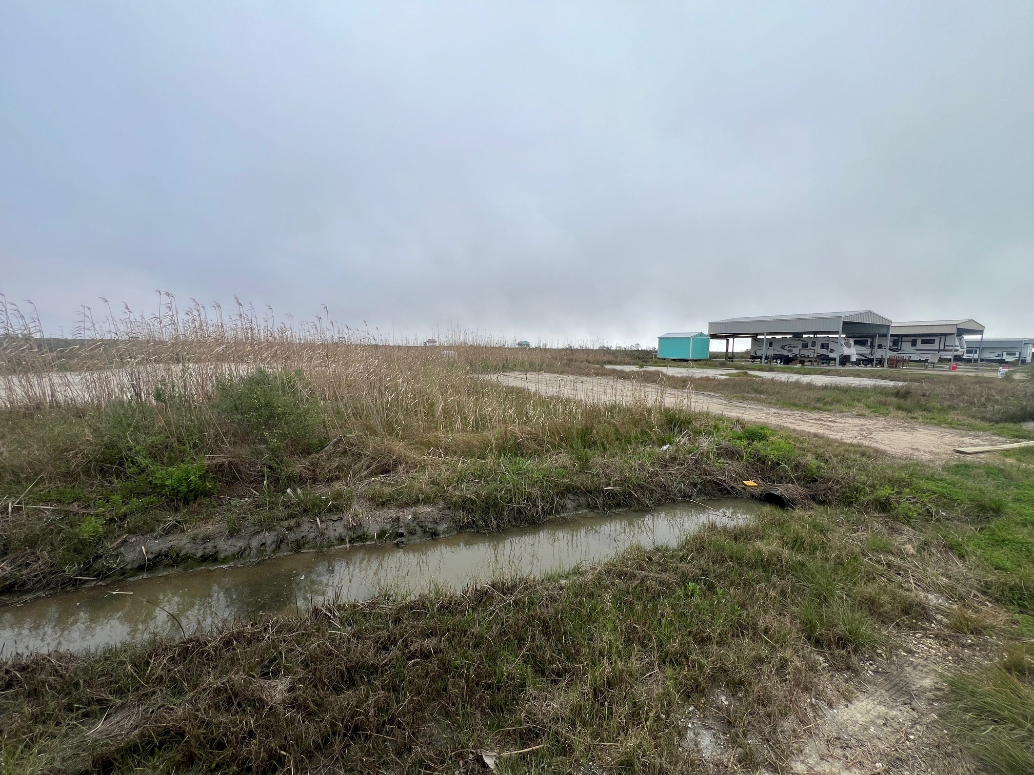 1334 Mabry Street Port Bolivar, TX 77650 - Photo 2 of 5 a view of a lake with houses in the back