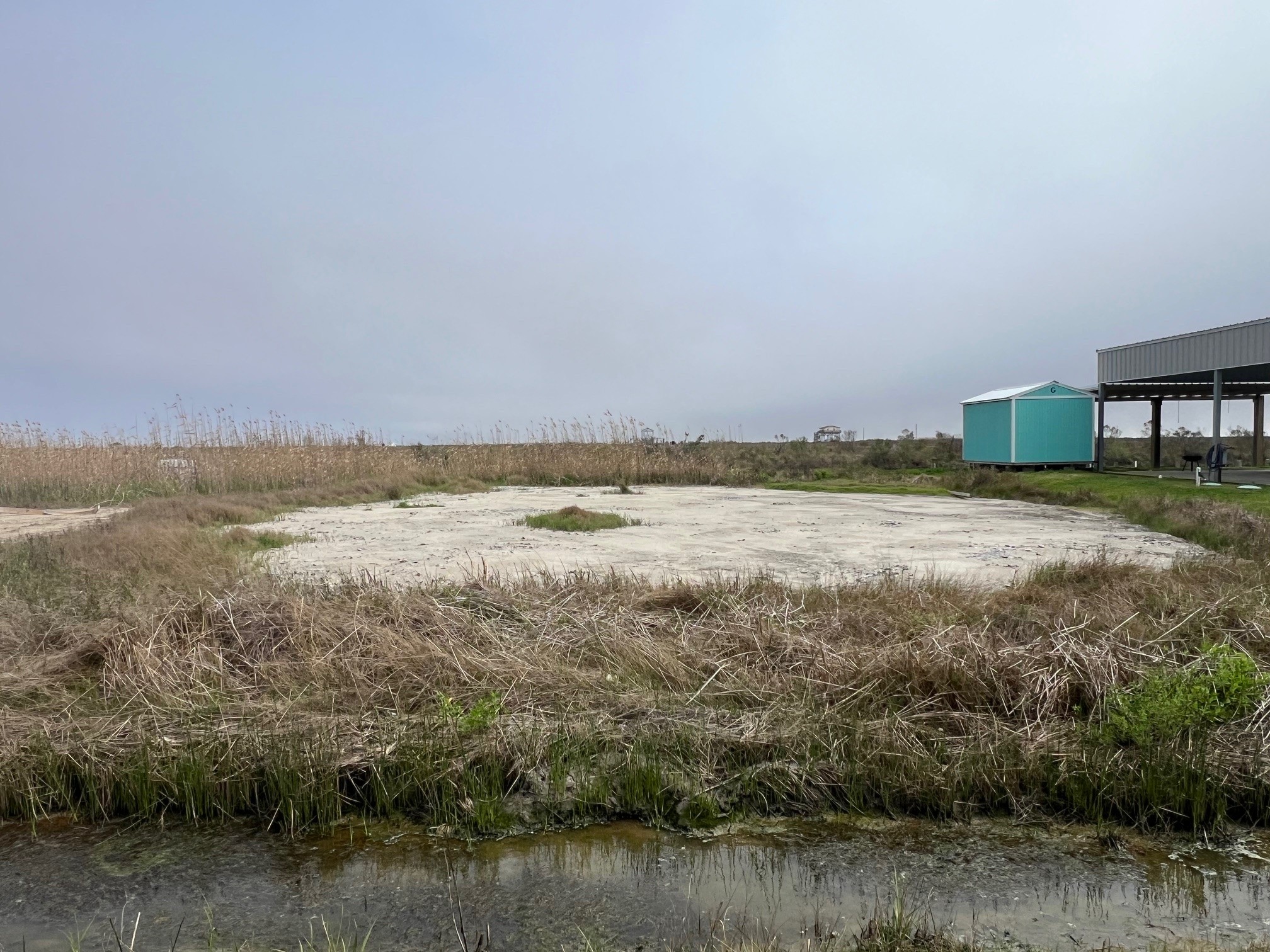 1334 Mabry Street Port Bolivar, TX 77650 - Photo 3 of 5 a view of a lake with houses in the background