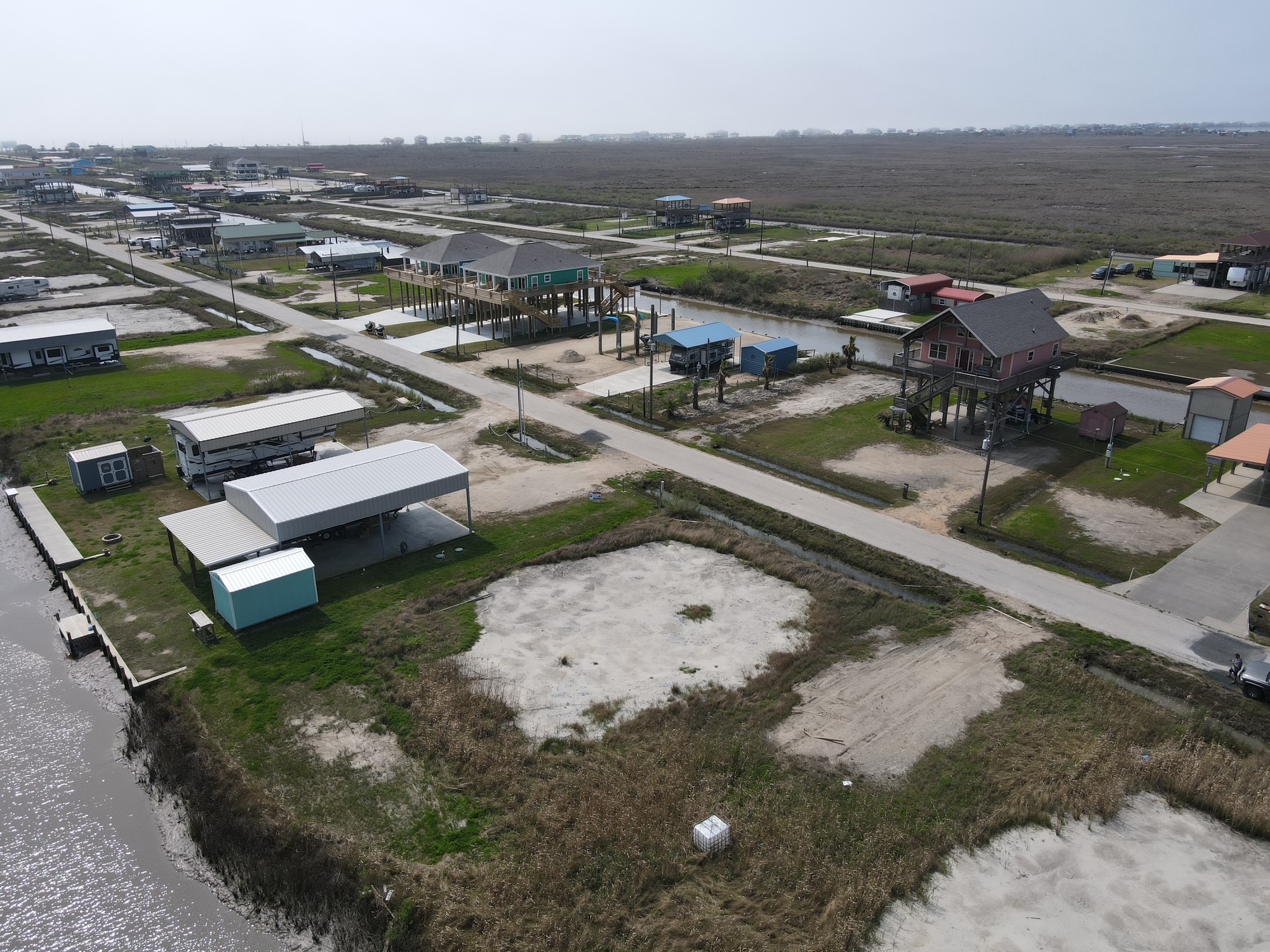 1334 Mabry Street Port Bolivar, TX 77650 - Photo 5 of 5 an aerial view of a house with a lake view