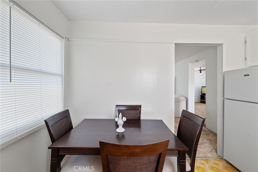28074 Waterman Road Barstow, CA 92311 - Photo 17 of 25 a view of a dining room with furniture and wooden floor