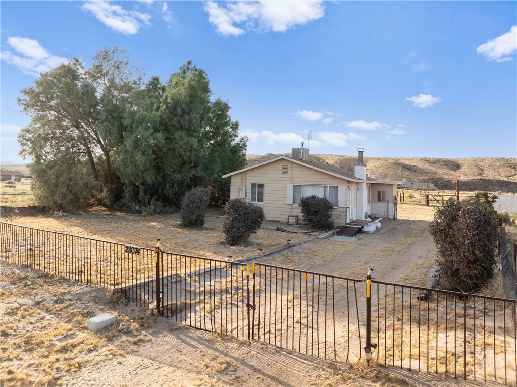 28074 Waterman Road Barstow, CA 92311 - Photo 3 of 25 a view of a house with a yard