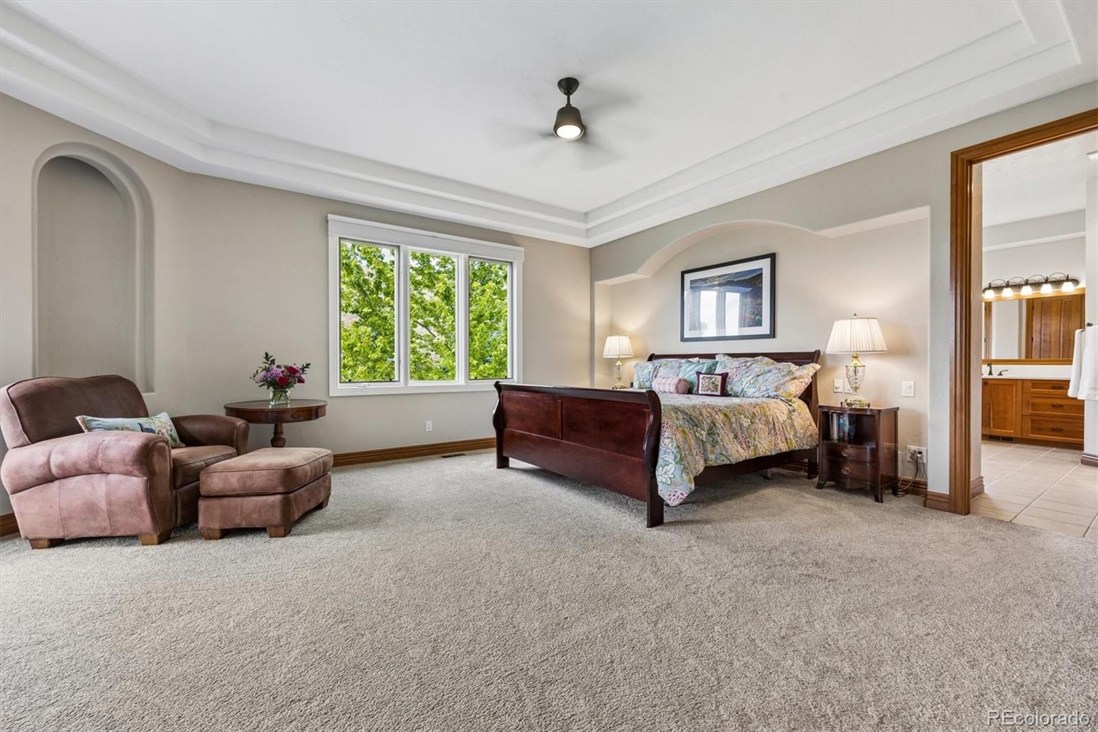 16422 Rocky Point Lane Morrison, CO 80465 - Photo 20 of 50 a bedroom with bed and a couch