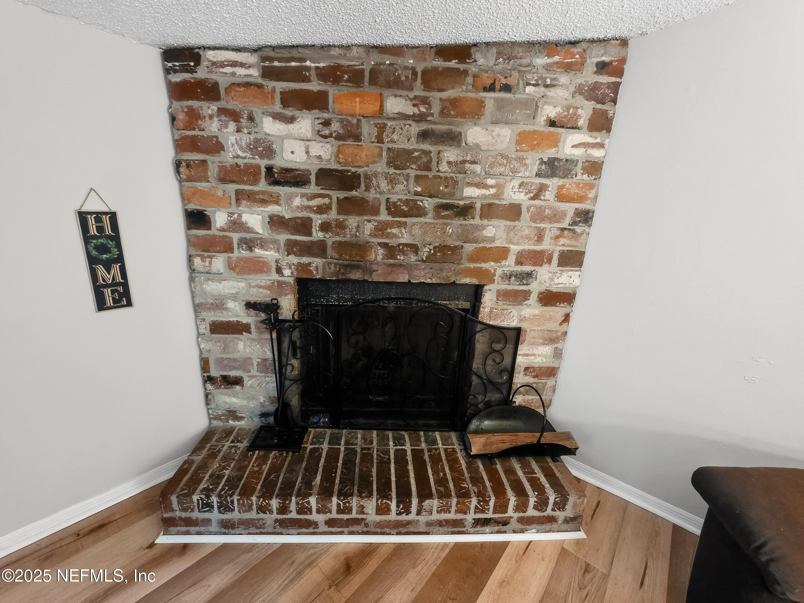 9332 Cedar Road Macclenny, FL 32063 - Photo 11 of 35 a view of an empty room with wooden floor and a window