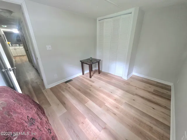 a bedroom with a bed and a table