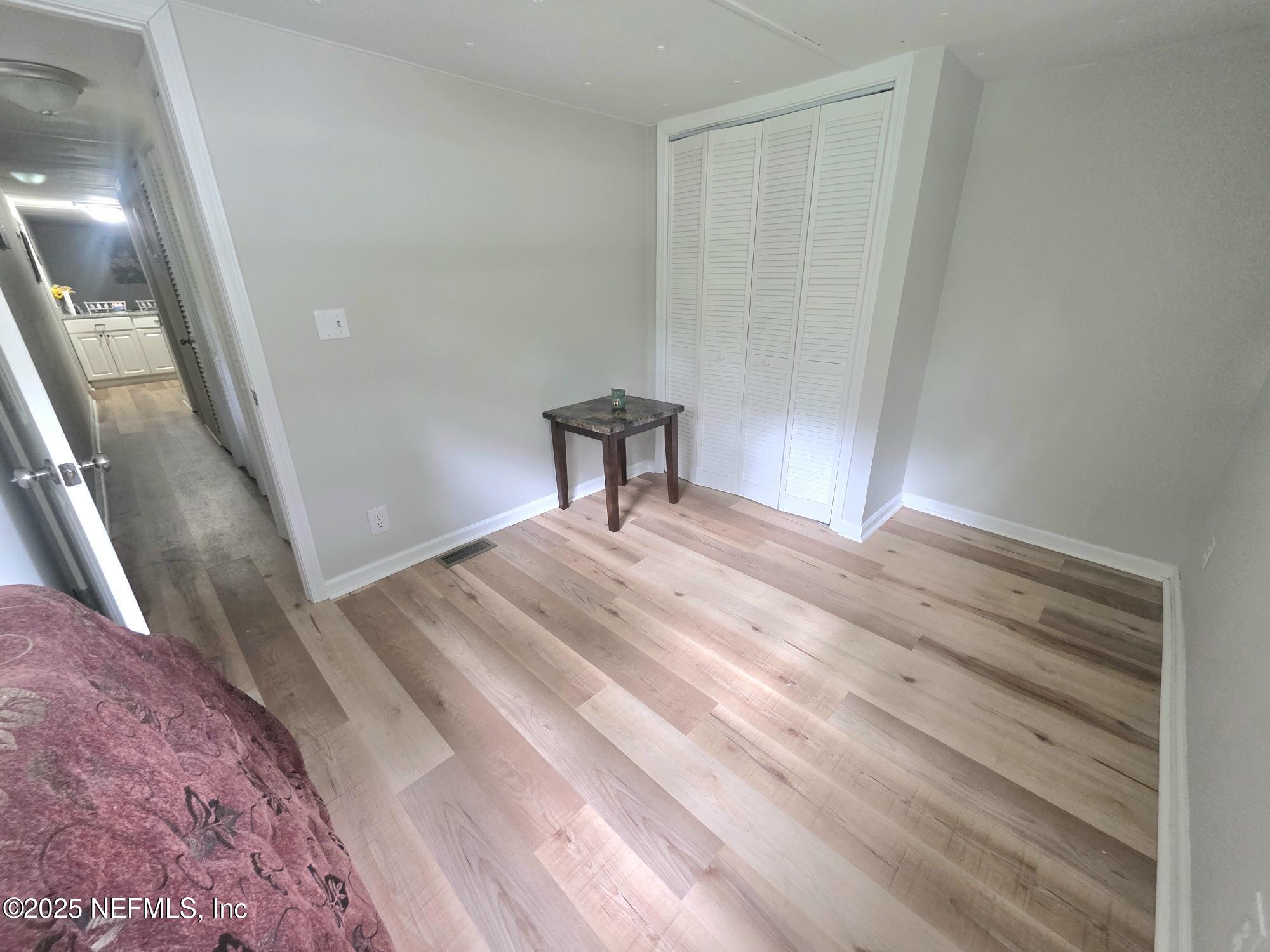 9332 Cedar Road Macclenny, FL 32063 - Photo 18 of 35 a bedroom with a bed and a table
