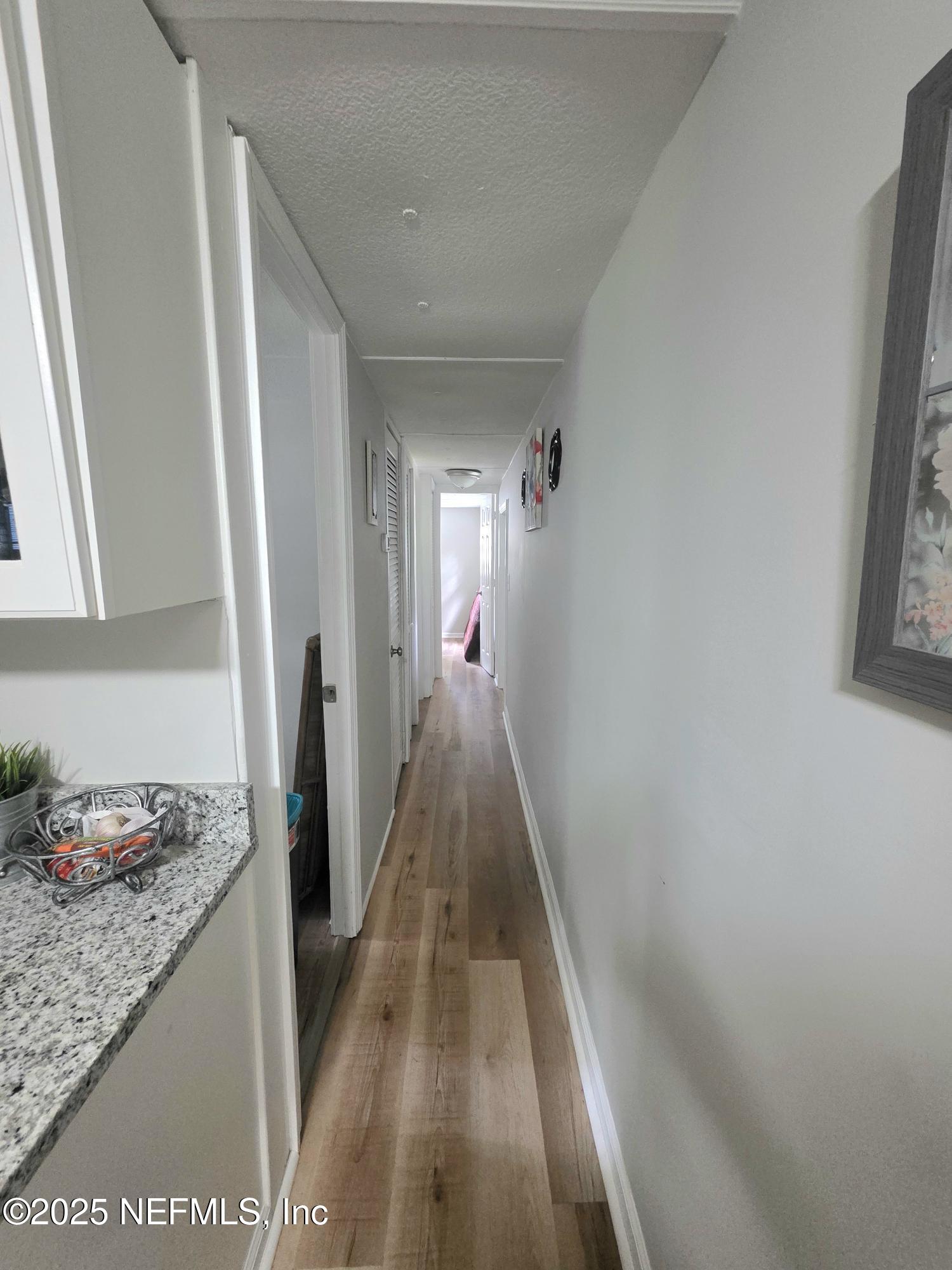 9332 Cedar Road Macclenny, FL 32063 - Photo 19 of 35 a hallway with dining table and chairs
