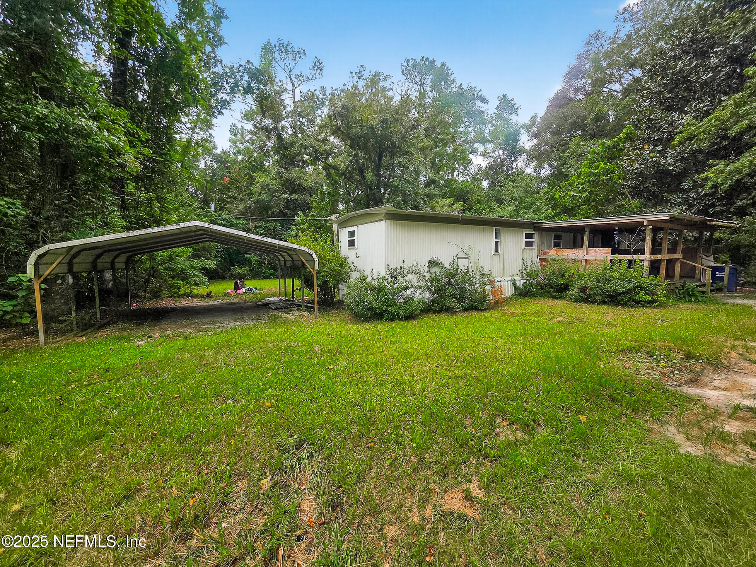 9332 Cedar Road Macclenny, FL 32063 - Photo 23 of 35 a view of a chair and table in the garden