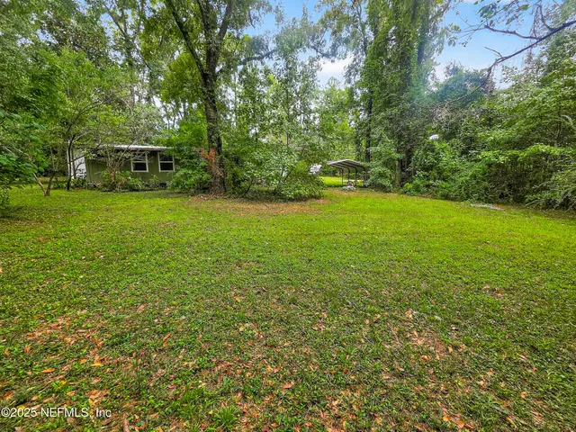 a view of backyard with outdoor space