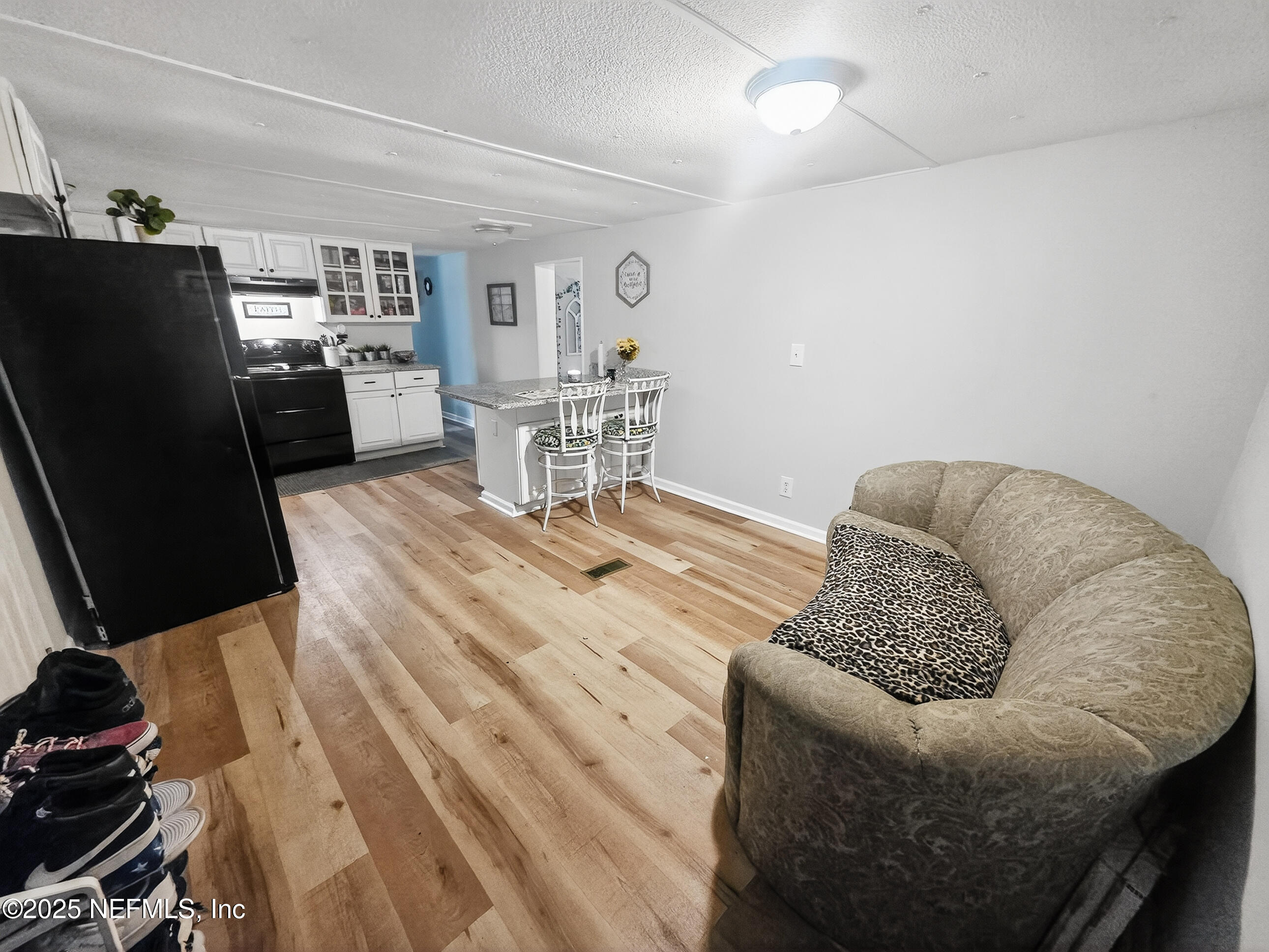 9332 Cedar Road Macclenny, FL 32063 - Photo 6 of 35 a living room with furniture and a flat screen tv