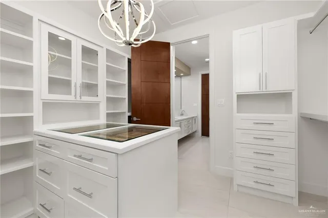a kitchen with a sink and cabinets