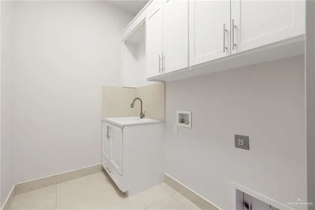 a bathroom with a sink and cabinets