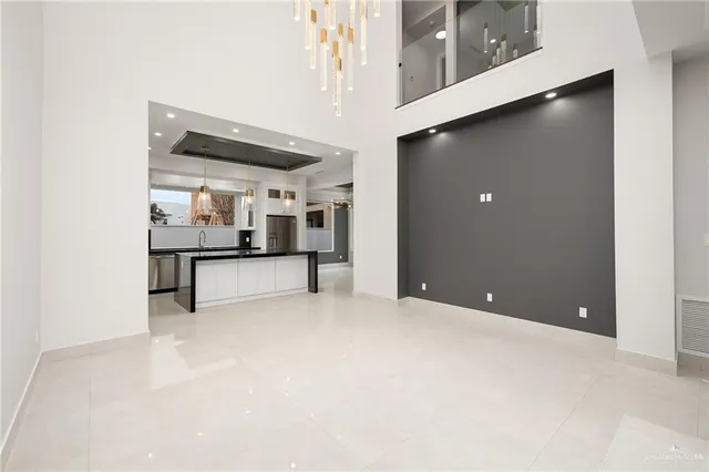 a view of an empty room with a cabinet