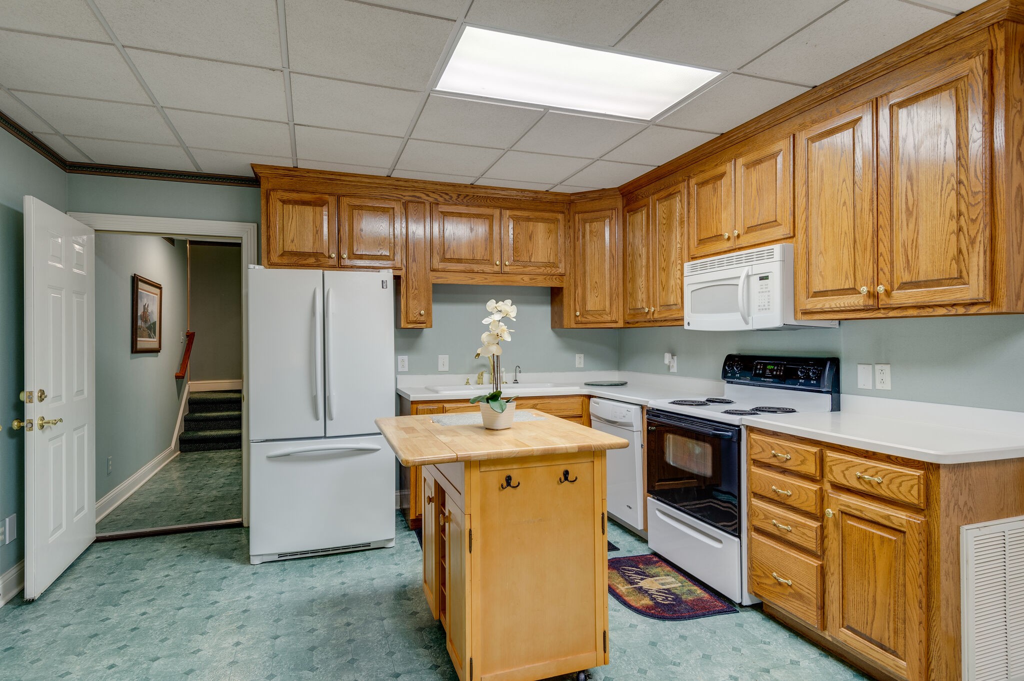 2295 Gideon Road Greenbrier, TN 37073 - Photo 40 of 48 a kitchen with stainless steel appliances granite countertop a sink stove and refrigerator