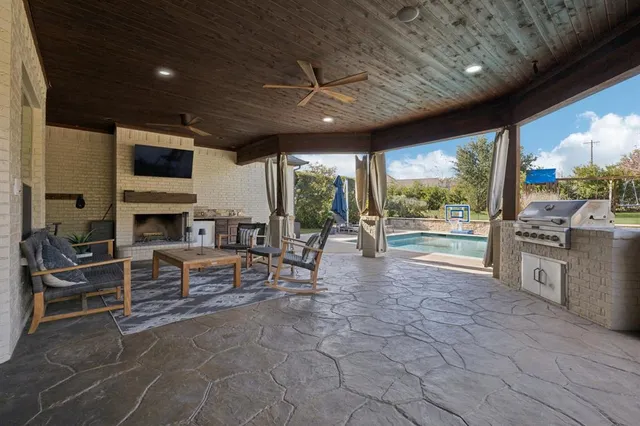a view of swimming pool with outdoor seating